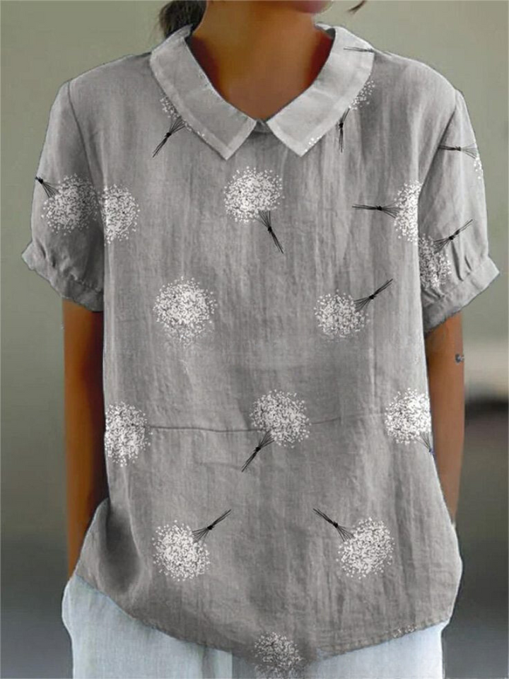 Elegant women's vintage floral blouse, short sleeve summer top with intricate embroidery.