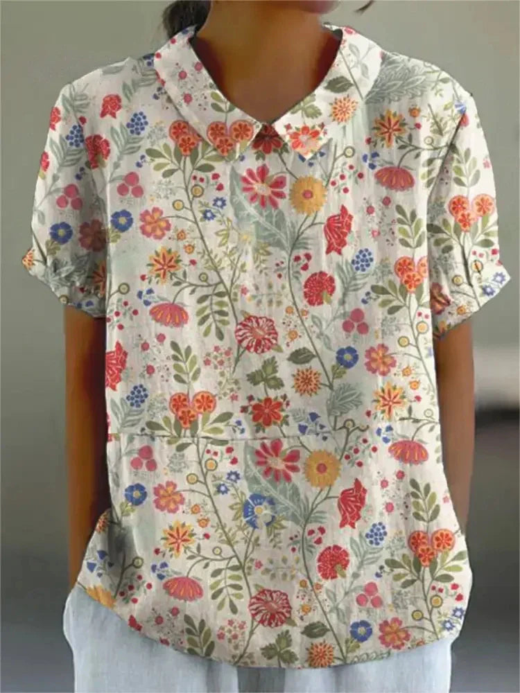 Collared short sleeve women's blouse, vintage floral print, embroidered details for a chic summer.