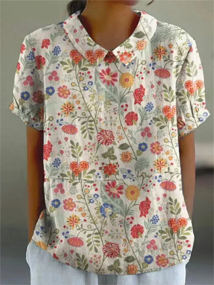 Collared short sleeve women's blouse, vintage floral print, embroidered details for a chic summer.