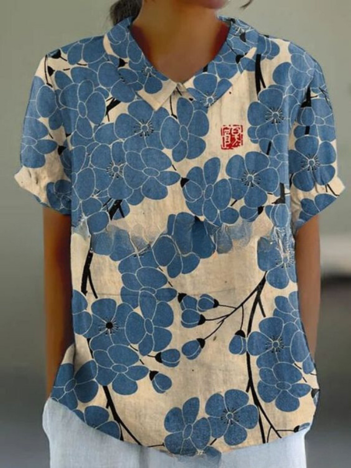 Delicate embroidered floral top for women, a chic short sleeve summer shirt with a vintage touch.