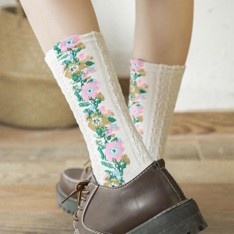 Stylish women's bucket bag, a chic fashion accessory, complementing the vintage floral socks.