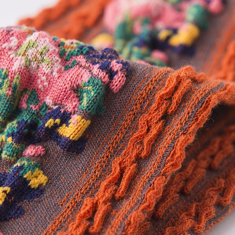 Set featuring a ladies bucket bag and vintage embroidered floral socks, essential fashion accessories.
