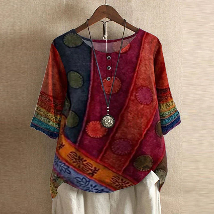 Casual women's blouse featuring vibrant vintage floral print and comfortable loose fit.