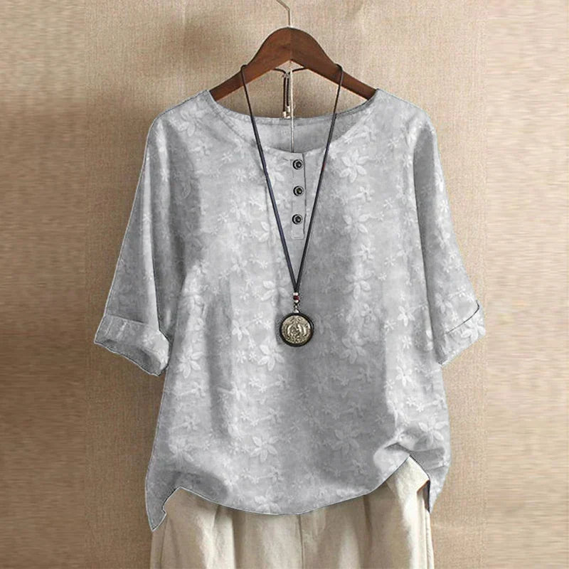 Relaxed fit women's blouse, artistic vintage floral print, perfect for comfortable summer wear.