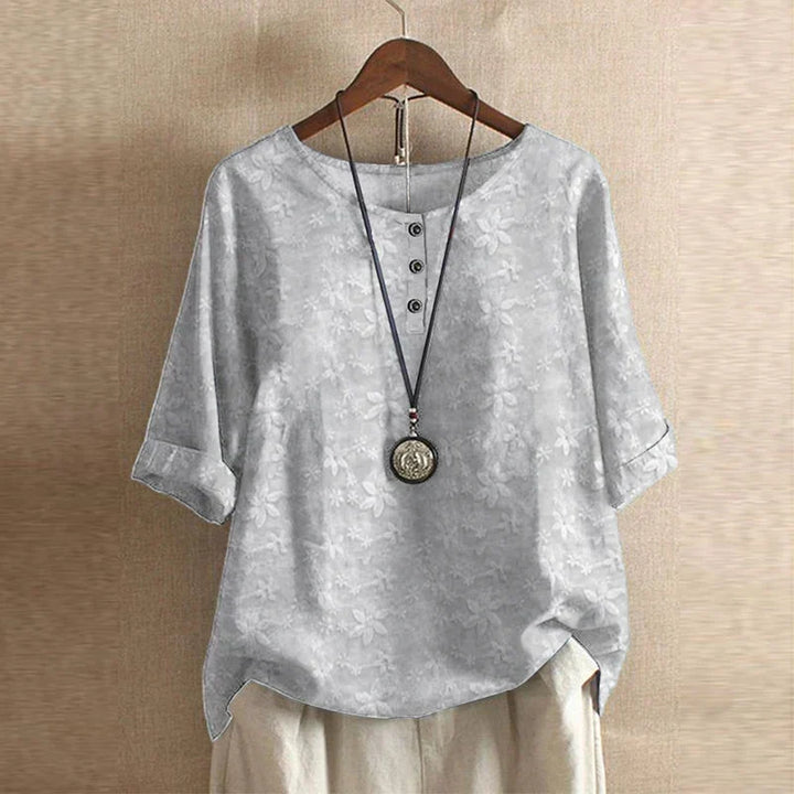 Relaxed fit women's blouse, artistic vintage floral print, perfect for comfortable summer wear.