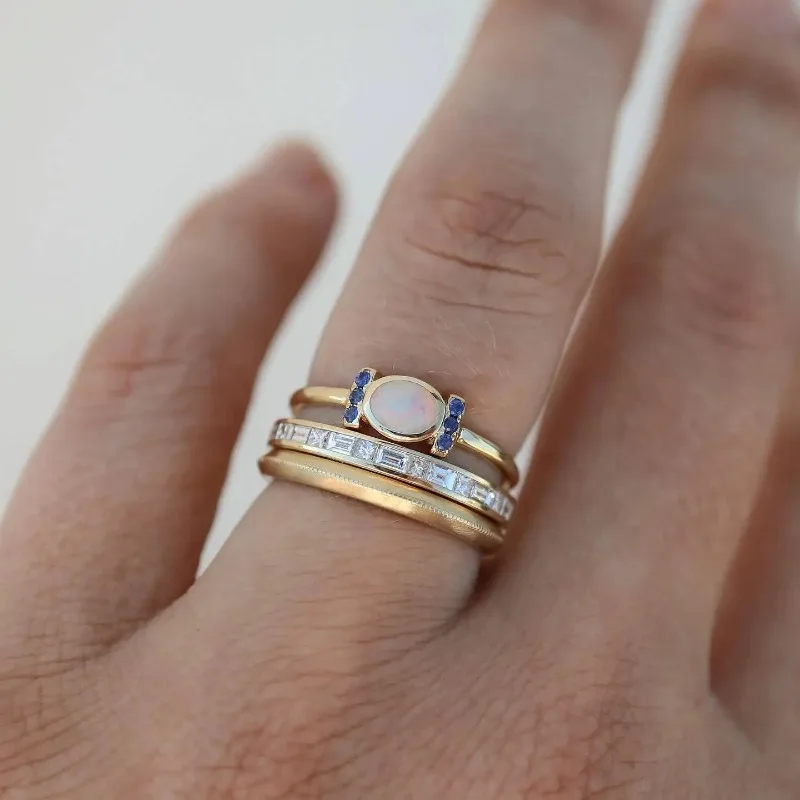 Women's vintage golden opal ring set, elegant stackable gold rings with shimmering opals, perfect fashion accessory.