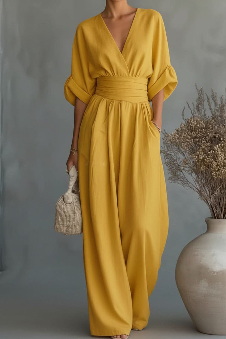 Elegant green women's vintage style jumpsuit. Ideal for casual wear or an evening outfit with effortless fashion.