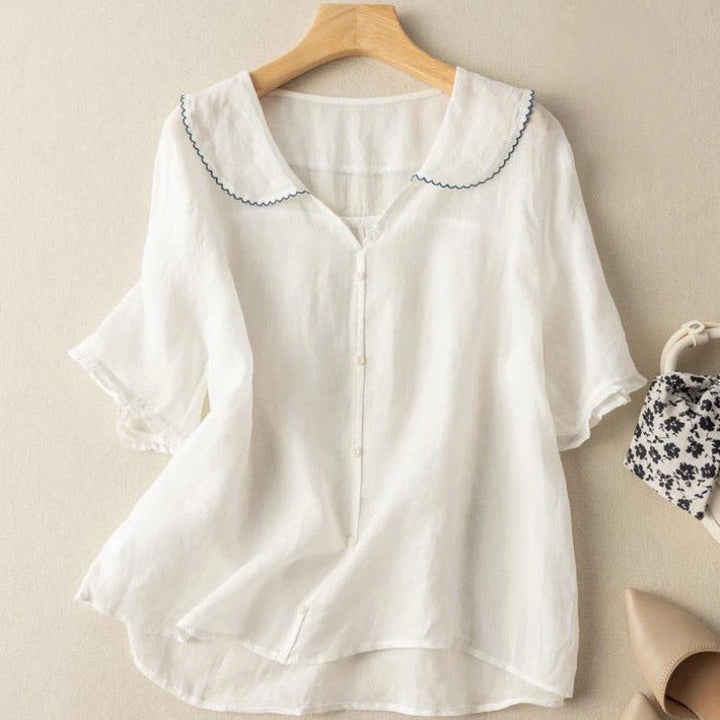 White women's elegant vintage scalloped collar blouse, button-down front. A timeless, versatile casual chic top.