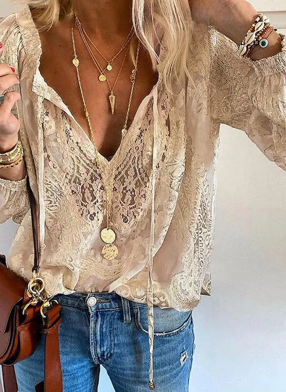 Women's vintage split neck bohemian blouse in flowy fabric. Perfect for casual summer & spring fashion.