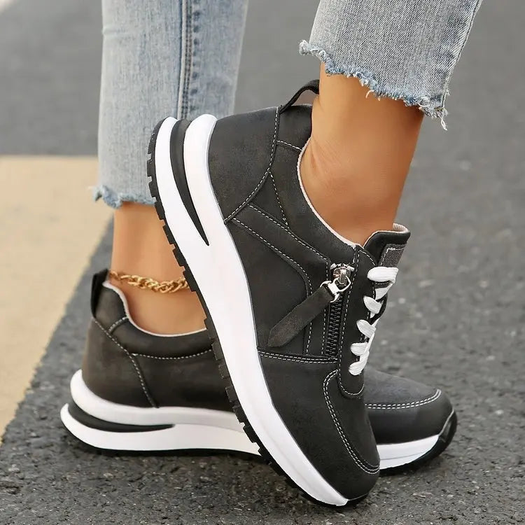 Lace-up women's everyday sneakers, vintage style with side zip feature, comfortable casual footwear.