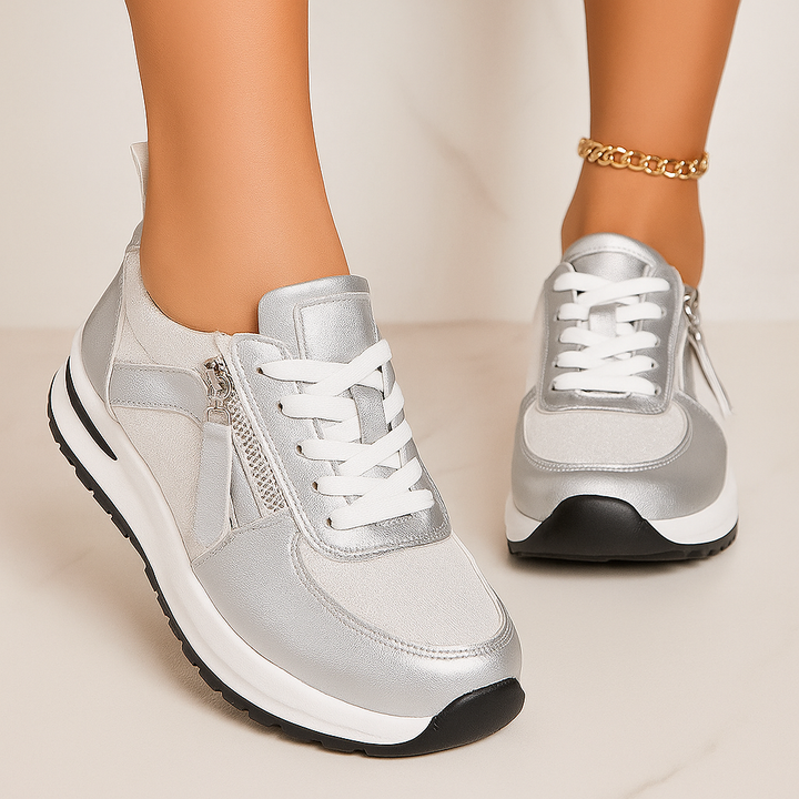 Pair of women's casual footwear, vintage-style lace-up runners in a neutral color for everyday.