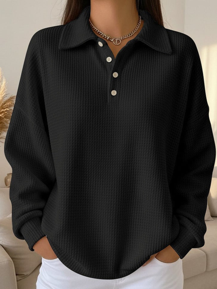 Cozy waffle knit collared henley sweater for women. Long sleeve, relaxed fit pullover ideal for autumn comfort.