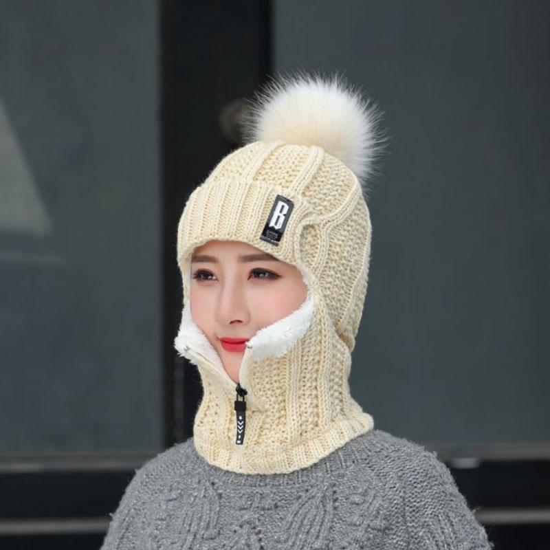Lifestyle shot of a woman enjoying outdoors, wearing a warm and windproof winter hat