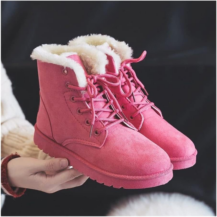 Fashionable women's winter boots, ankle height, with secure lace-up closure for warmth and support.