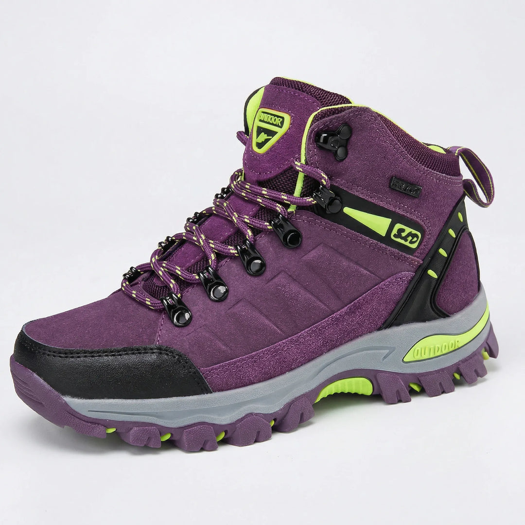 Durable women's trekking boots with ankle & arch support, water-repellent for rugged outdoor trails.
