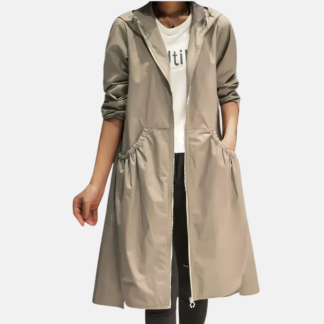 Women's water-resistant hooded knee-length rain jacket. Lightweight outerwear perfect for spring, fall, and commute.