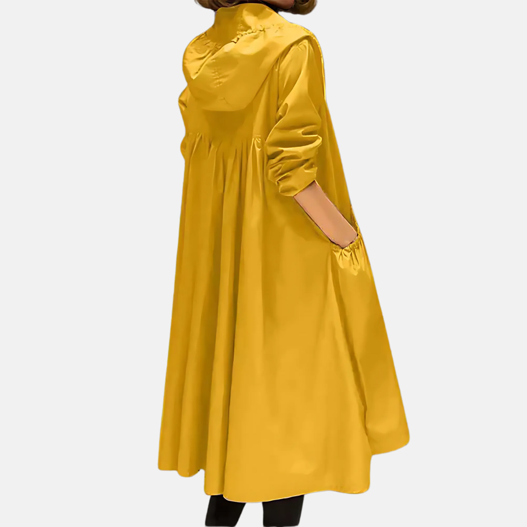 Fashionable women's knee-length rain jacket. Hooded, water-resistant outerwear for spring, fall, and urban commute.