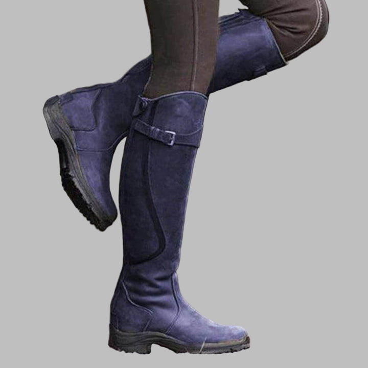 Stylish women's tall equestrian boots, waterproof, with a secure grip sole for enhanced stability & all-weather riding.