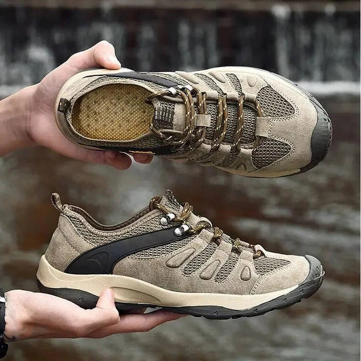 Woman wearing waterproof hiking shoes, confidently walking on a rugged outdoor trail.
