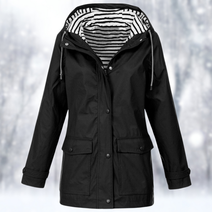 Women's waterproof hooded raincoat for all-weather protection. Lightweight, ideal for outdoor travel.