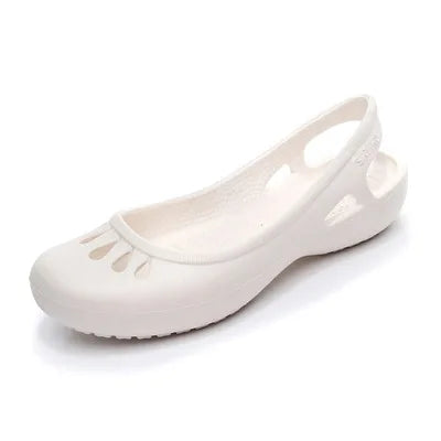 Women's waterproof flat jelly slide sandals featuring a chic cut-out pattern, great for vacation.