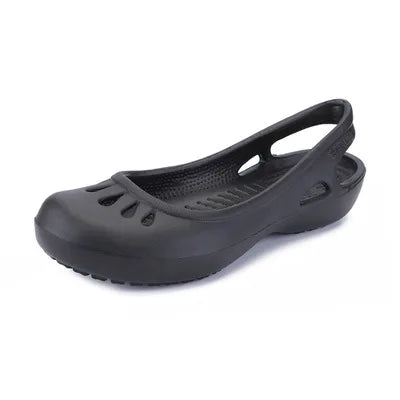 Stylish women's waterproof flat sandals with a unique cut-out design, perfect as summer slides.
