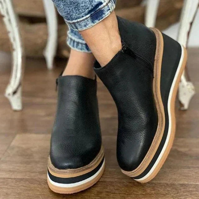 Durable women's waterproof ankle boots with side zipper, offering orthopedic comfort for all-day wear.