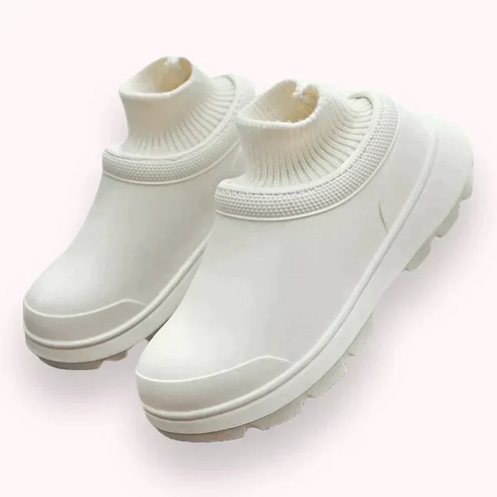 Women's waterproof slip-on clogs with a stylish knit ankle cuff, perfect for all-weather comfort.