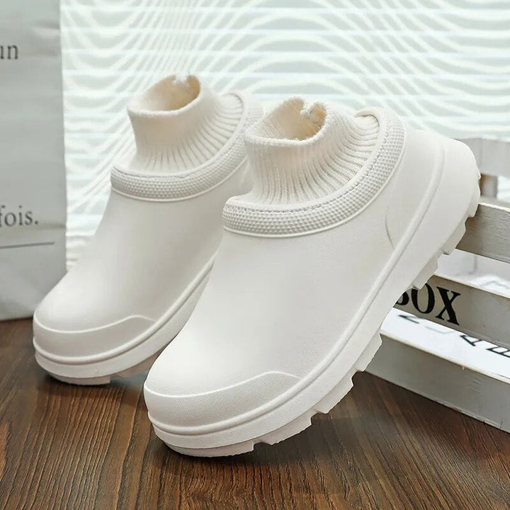 Women's comfortable all-weather clogs: waterproof slip-on design with a stylish knit cuff.