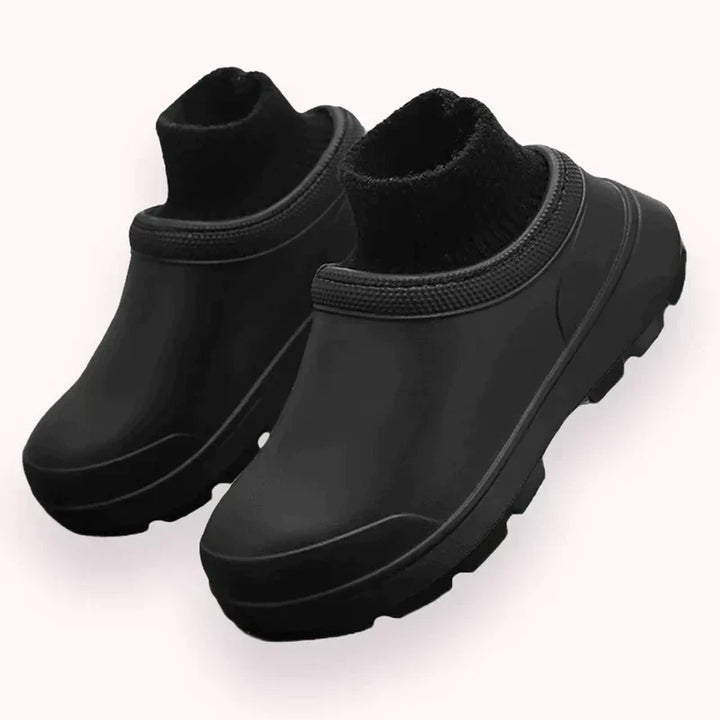 Comfortable slip-on clogs for women, waterproof design with a fashionable knit ankle cuff for casual style.