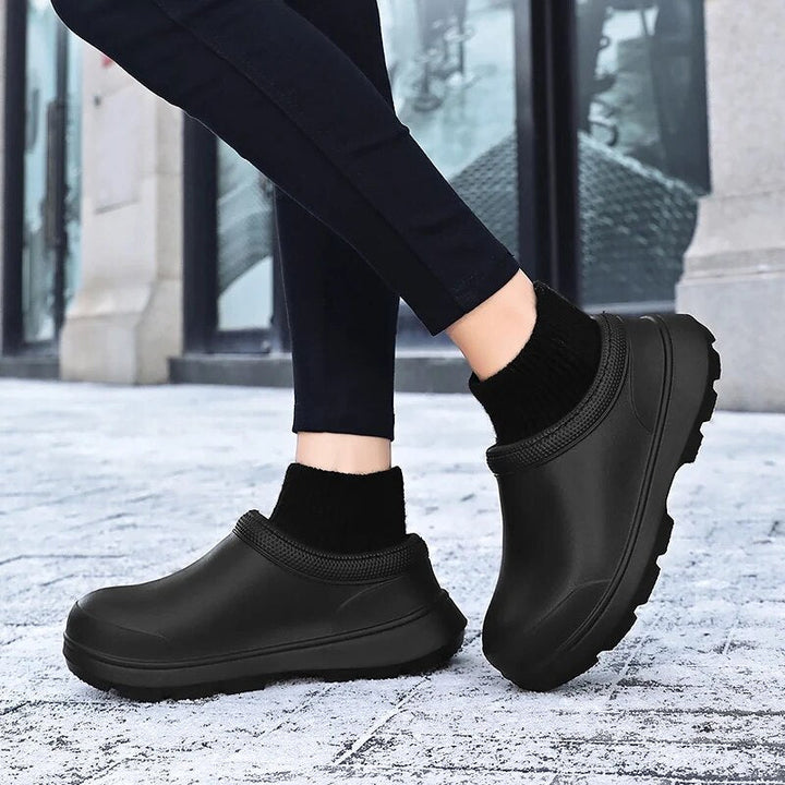 Durable women's waterproof slip-on clogs, designed with a snug knit ankle cuff and non-slip sole.