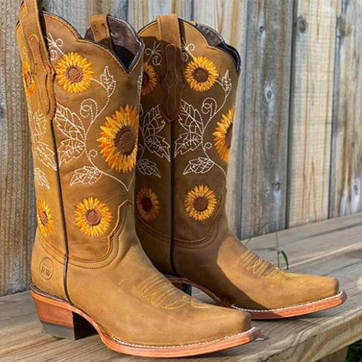Women's Western cowboy boots with intricate sunflower embroidery & stylish pointed toe. Perfect for country style.