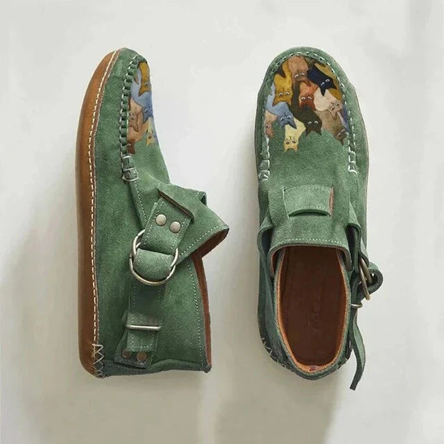 Comfortable women's slip-on shoes featuring a fun cat design, perfect for casual footwear