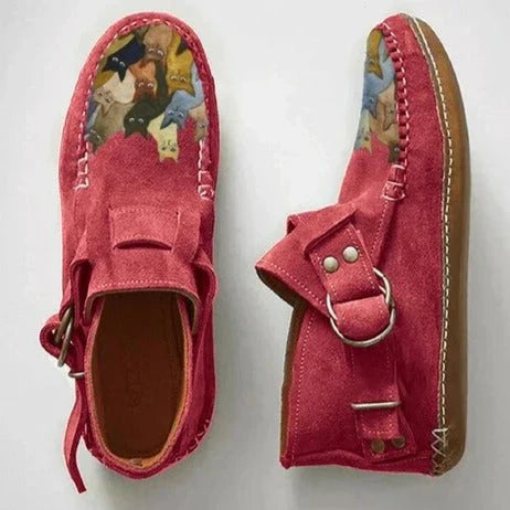 Close-up of a women's slip-on shoe, highlighting the unique cat design and comfortable fit
