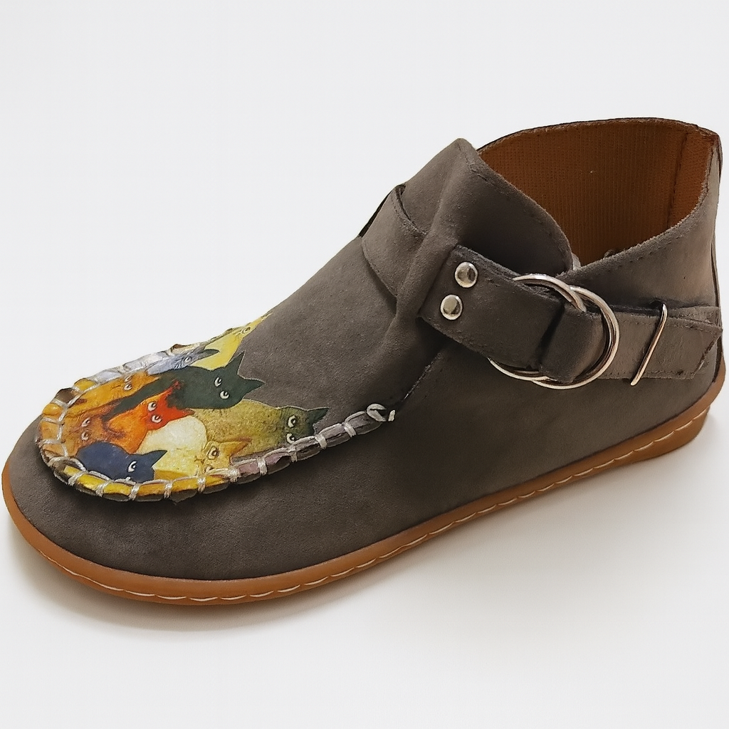 Side view of women's slip-on casual shoes, featuring a charming whimsical cat face motif