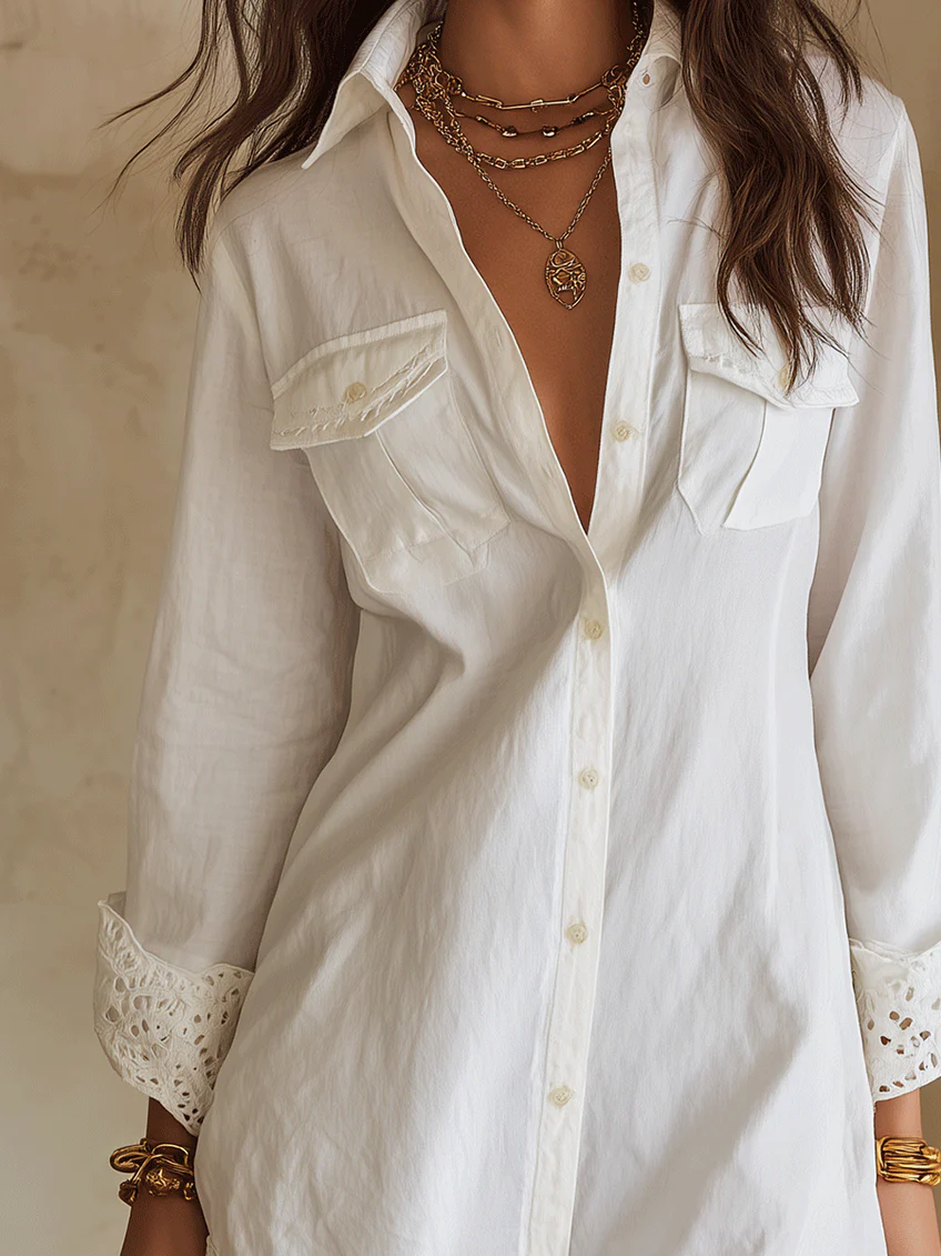 White button-front collared mini shirt dress with delicate crochet hem. Ideal as a stylish beach coverup.