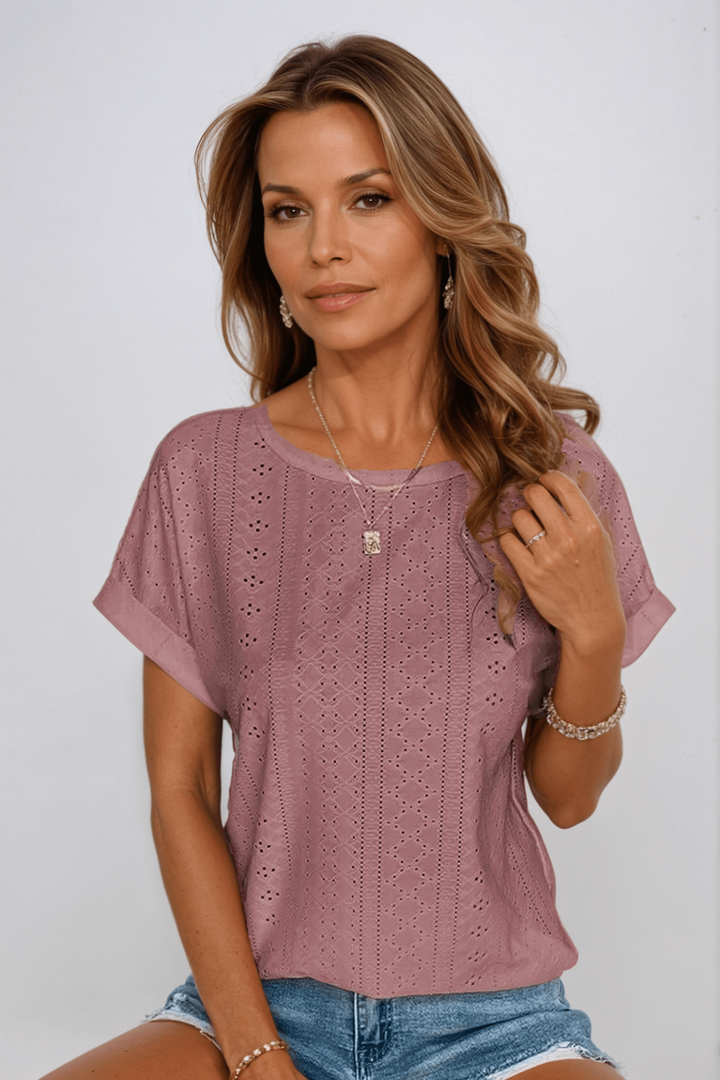 Versatile women's eyelet round neck top, short sleeve. Lightweight and breezy, ideal for casual summer style.