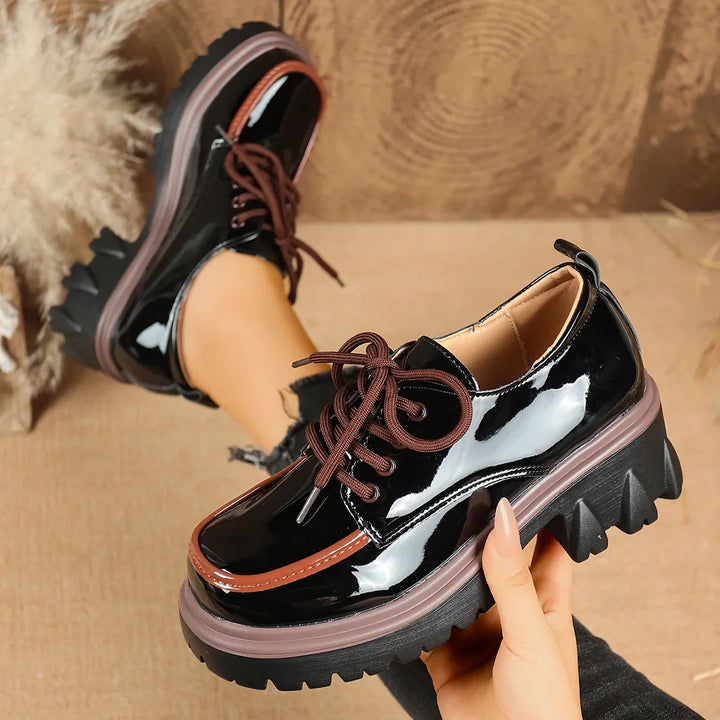 Pair of women's vibrant red platform sneakers, featuring a shock-absorbing and stylish design