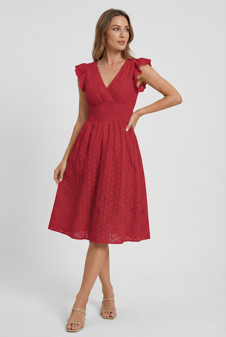 Feminine women's white eyelet dress, midi length, flared, with graceful ruffled sleeves.