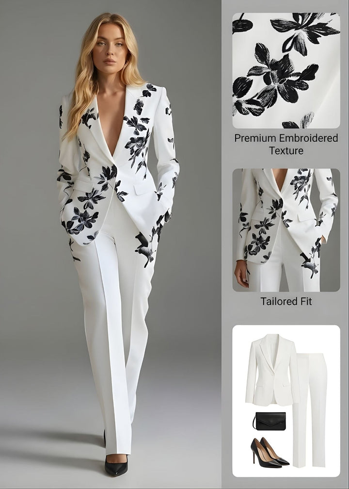 Women's white floral pant suit with tailored single-button blazer and matching elegant trousers for professional wear.