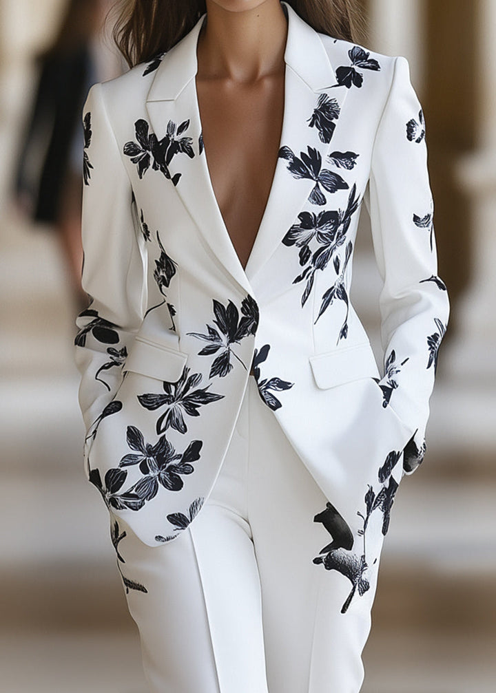 Stylish women's floral two-piece pant suit, featuring a tailored blazer & trousers, perfect for spring occasion wear.