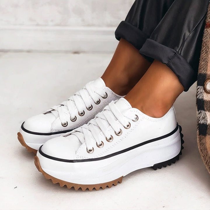 Chic women's low-top platform sneakers, white with star detail & lace-up closure. Trendy casual everyday shoes.