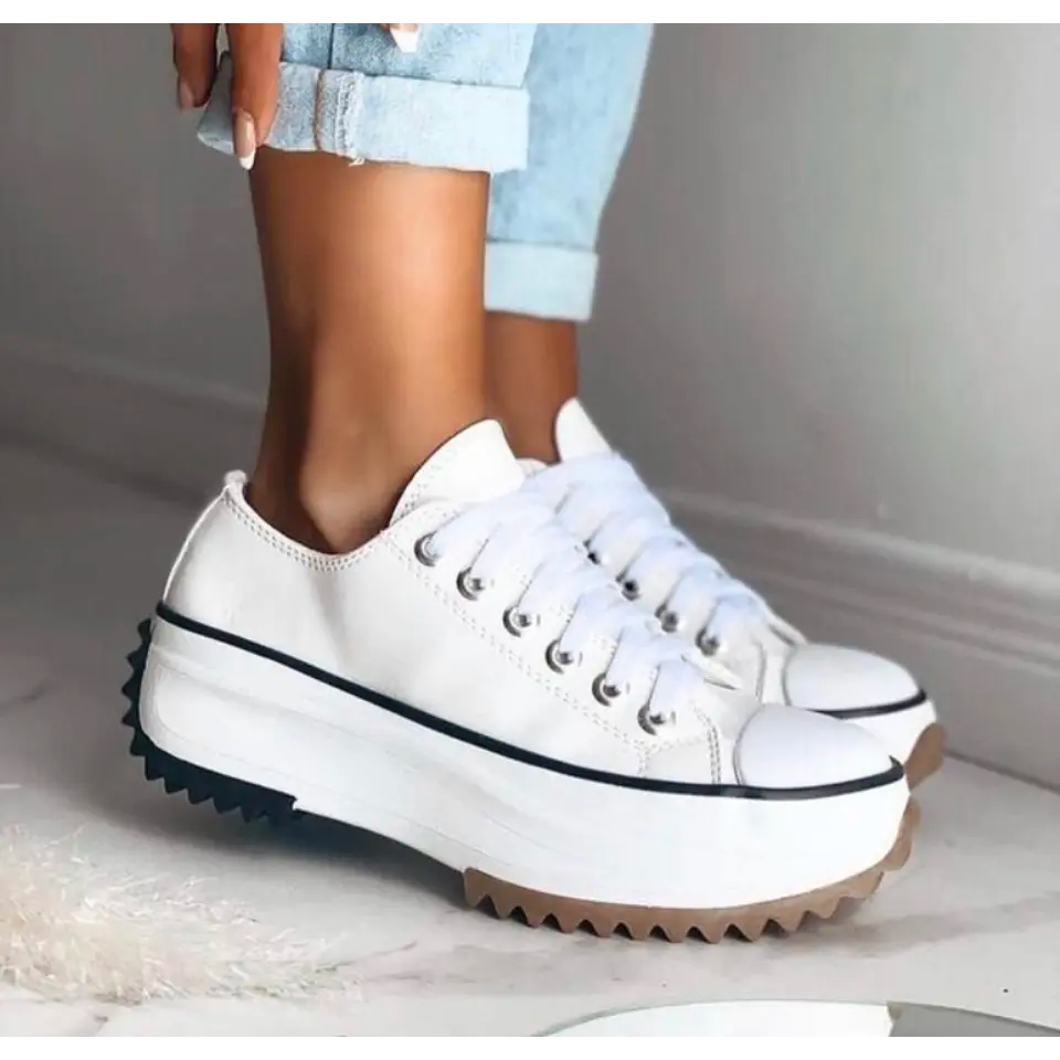 Trendy women's low-top platform sneakers with lace-up closure & star detail. Chic, elevated sole casual footwear.