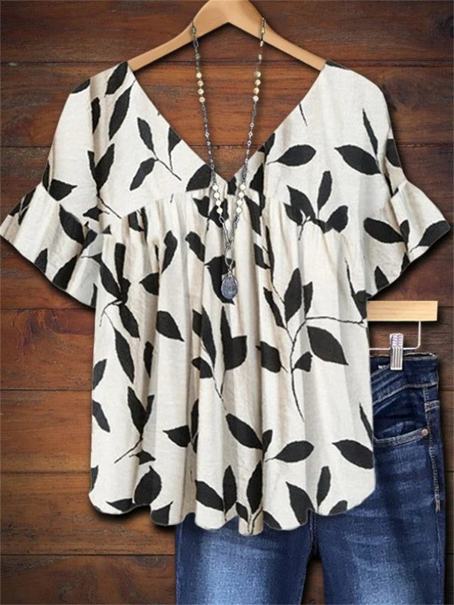 Women's white leaf print V-neck flutter sleeve blouse, a stylish and relaxed fit summer top for casual wear.