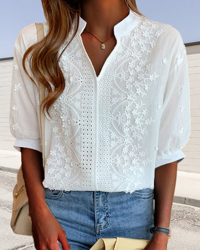 Women's white mandarin collar blouse with floral embroidery & puff sleeves. Elegant spring/summer chic top.