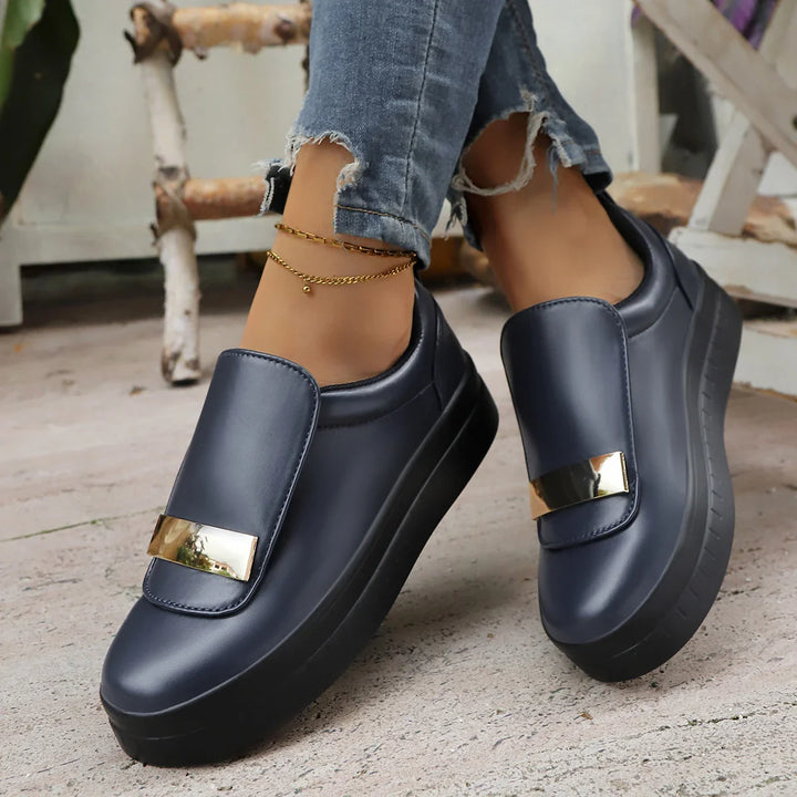 Women's white platform sneakers with orthopedic insole laid out on a clean background.
