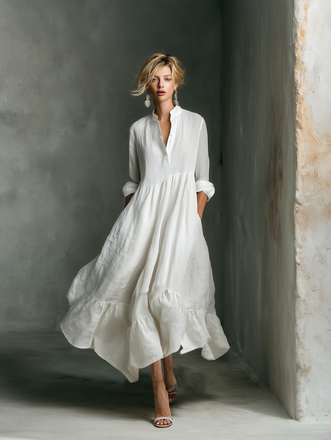 Elegant women's white tiered maxi dress featuring a chic stand collar and button placket for a casual look.