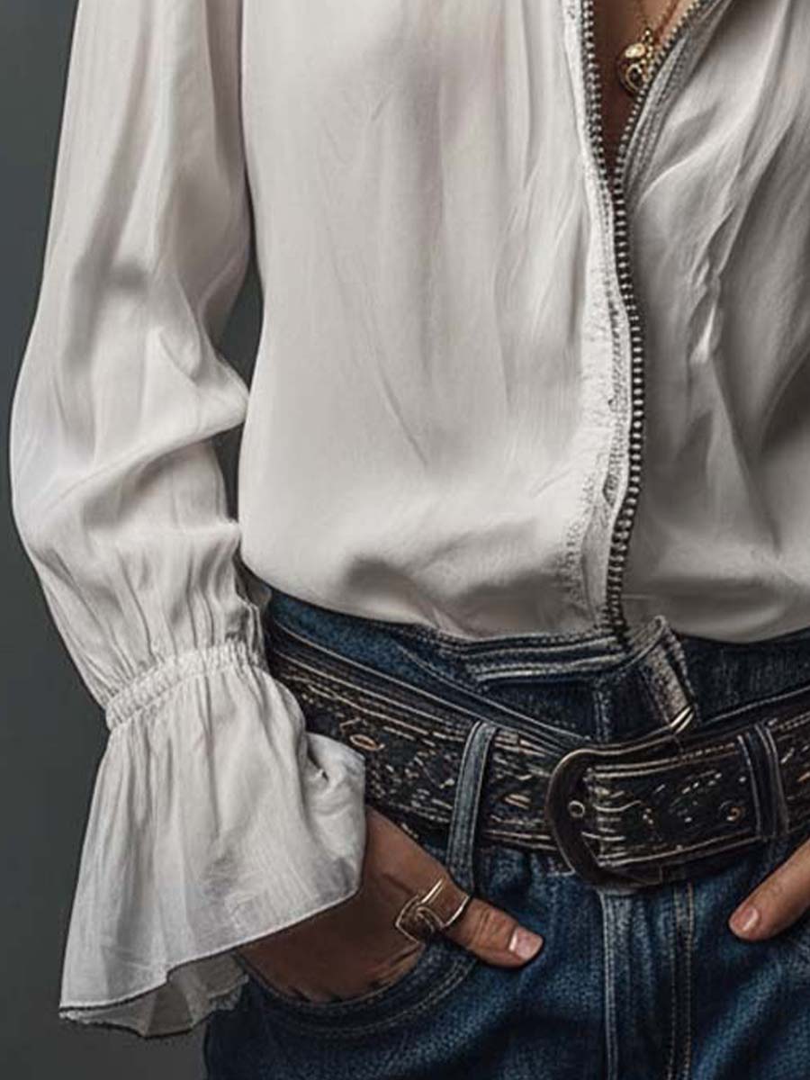 Crisp white women's blouse with a practical zip-front and chic bell cuffs. A versatile long-sleeve top.