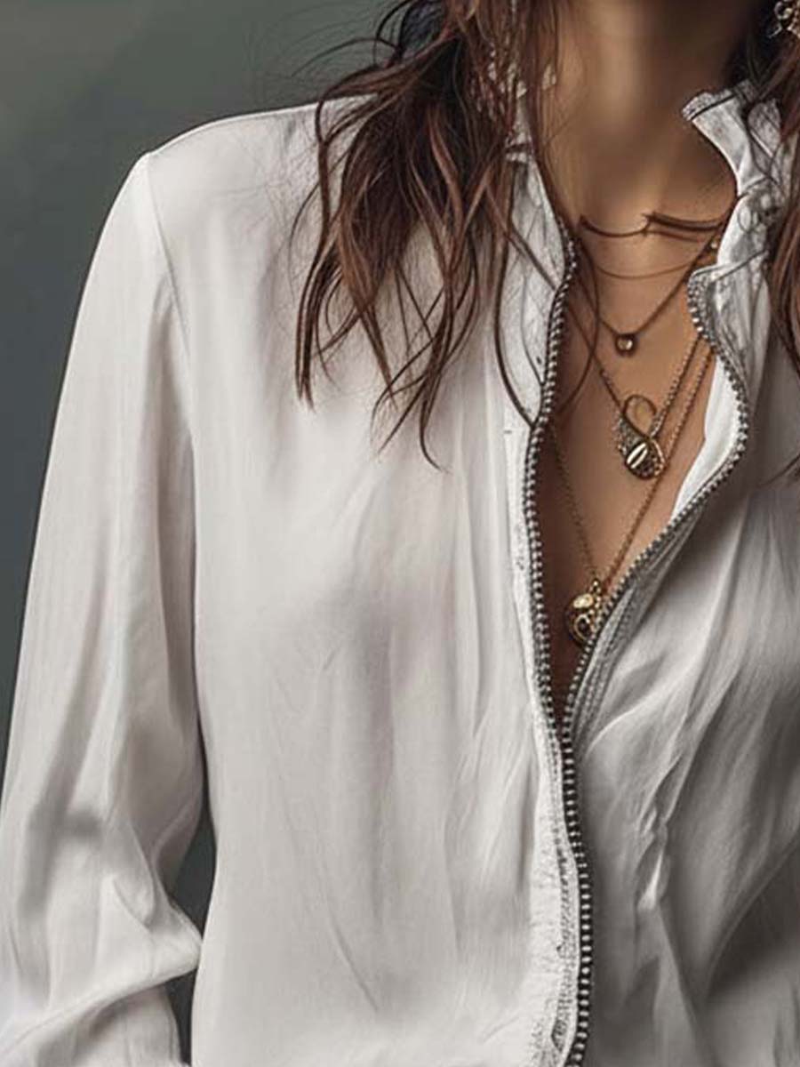 Versatile white zip-front blouse for women, designed with bell cuffs. Great for office or casual chic style.