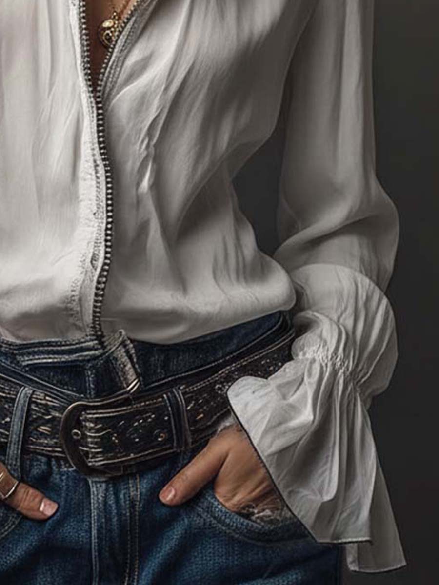 White long-sleeve women's blouse, zip-front closure, and elegant bell cuffs. A modern tailored fit top.